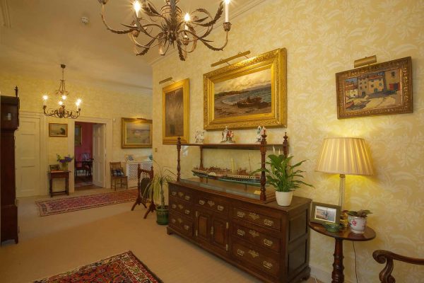 A colour image of the main downstairs hallway at Edradynate Country House and Sporting Estate Scotland. Edradynate is available for rent, shoot days, fishing and family holidays on a catered or self catered basis.