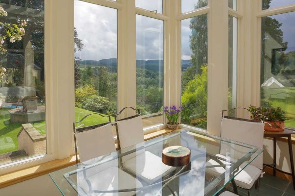 A colour photograph of the conservatory at EdradynateLuxury self catering accommodation in Scotland - Edradynate Country House and Sporting Estate House Perthshire