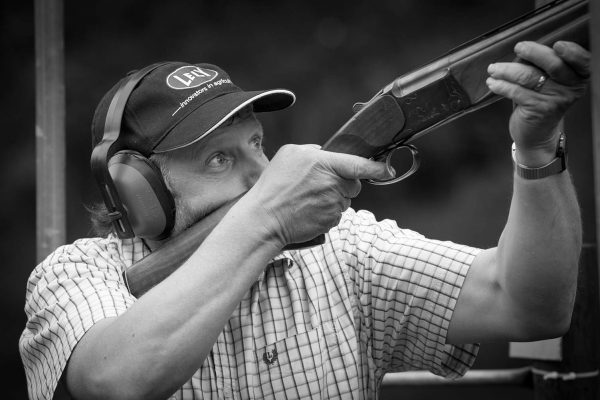 A black and white photo of a guest enjoying clay pigeon shooting at the Edradynate clay pigeon shoot day May 2017 - Edradynate Estate, Perthshire - Luxury Country House and Sporting Estate for Rent in Scotland