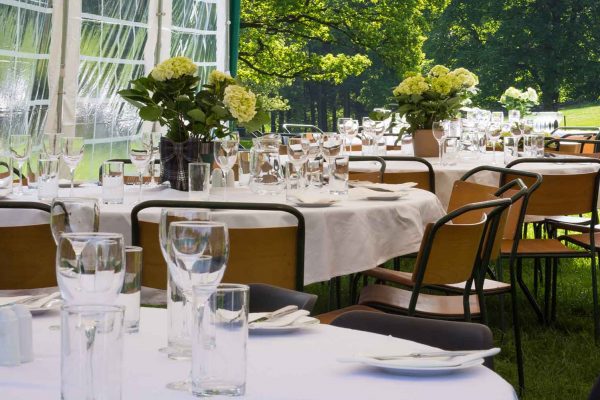 A colour image of beautifully laid dining tables in a marquee at the Edradynate May 2017 clay pigeon shoot day - Edradynate Estate, Perthshire - Luxury Country House and Sporting Estate for Rent in Scotland