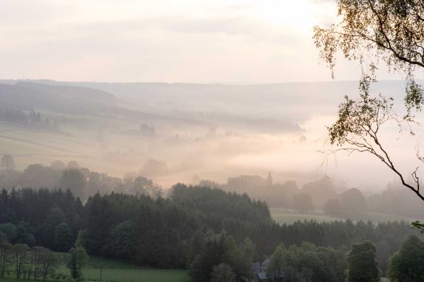 An image taken in the morning showing mist across the hills at Edradynate Estate, Perthshire - Luxury Country House and Sporting Estate for Rent in Scotland