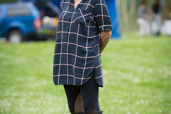 A colour image of a female guest in shoot apparel spectating at the Edradynate May 2017 clay pigeon shoot day - Edradynate Estate, Perthshire - Luxury Country House and Sporting Estate for Rent in Scotland