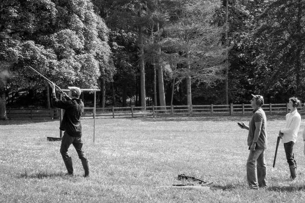 A black and white image of guests clay pigeon shooting at at the Edradynate May 2017 shoot day - Edradynate Estate, Perthshire - Luxury Country House and Sporting Estate for Rent in Scotland