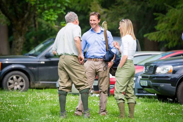 A colour image of guests socialising at the Edradynate May 2017 clay pigeon shoot day - Edradynate Estate, Perthshire - Luxury Country House and Sporting Estate for Rent in Scotland