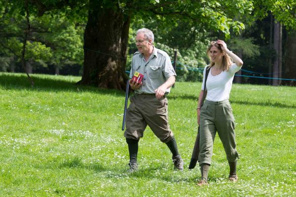 A colour image of guests walking and carrying guns at the Edradynate May 2017 clay pigeon shoot day - Edradynate Estate, Perthshire - Luxury Country House and Sporting Estate for Rent in Scotland