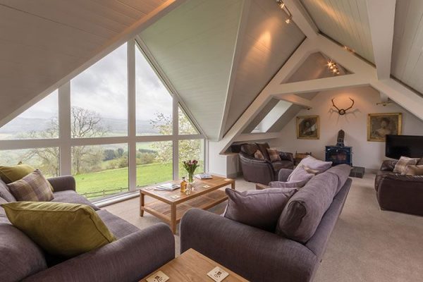 A colour image of the living areas with spectacular views at Aodin - accommodation for a a self catering holiday Scotland - Edradynate Country House and Sporting Estate Perthshire