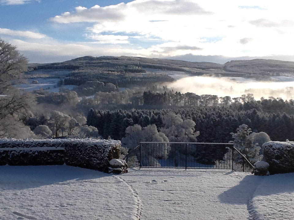 A colour image showing Edradynate Estate Perthshire in the snow